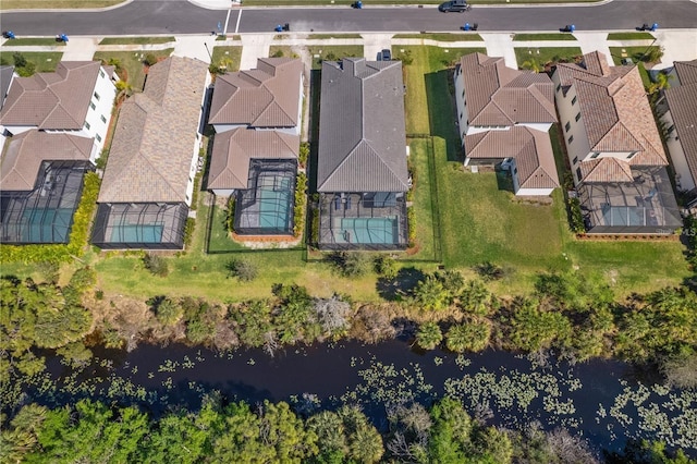 aerial view with a water view and a residential view