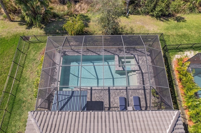 view of basketball court featuring a tennis court and fence