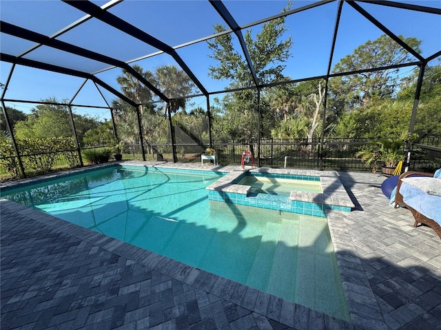 view of swimming pool with a patio area and a pool with connected hot tub