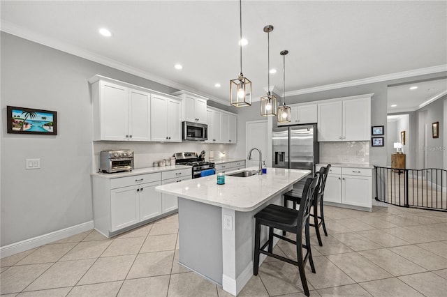 kitchen with appliances with stainless steel finishes, light tile patterned floors, recessed lighting, and a sink