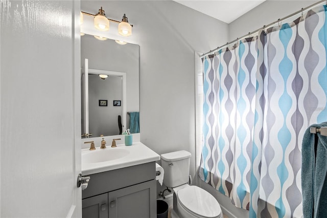 full bathroom featuring toilet, vanity, and shower / bath combination with curtain