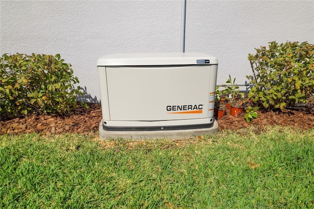 details featuring stucco siding and a power unit