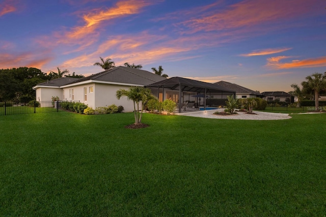 14210 9th Ter NE, Bradenton, FL 34212 - back of property featuring glass enclosure, a tiled roof, and stucco siding