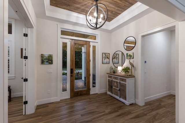 14210 9th Ter NE, Bradenton, FL 34212 - foyer featuring a tray ceiling, a chandelier, dark wood-style floors, baseboards, and crown molding