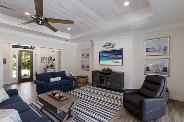 14210 9th Ter NE, Bradenton, FL 34212 - living room featuring a raised ceiling, wood finished floors, recessed lighting, baseboards, and a ceiling fan