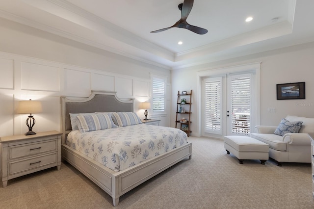 14210 9th Ter NE, Bradenton, FL 34212 - bedroom with access to exterior, a tray ceiling, light colored carpet, crown molding, and ceiling fan