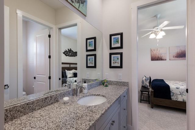14210 9th Ter NE, Bradenton, FL 34212 - bathroom featuring connected bathroom, toilet, vanity, and a ceiling fan