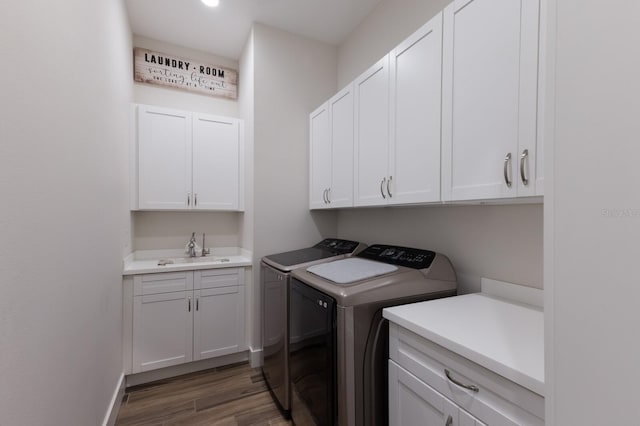 14210 9th Ter NE, Bradenton, FL 34212 - washroom featuring separate washer and dryer, cabinet space, wood finished floors, and baseboards