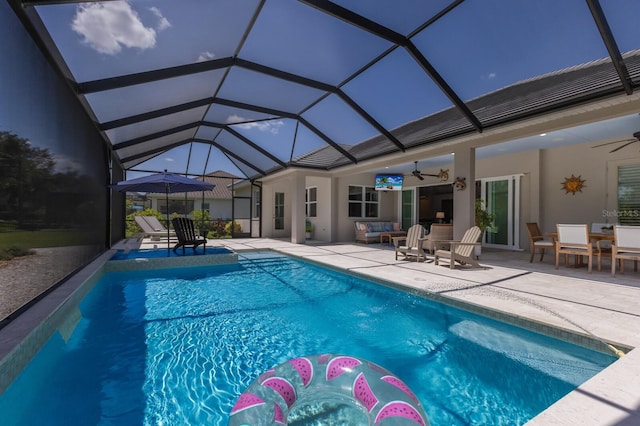 14210 9th Ter NE, Bradenton, FL 34212 - swimming pool featuring a ceiling fan, a patio area, outdoor lounge area, and glass enclosure