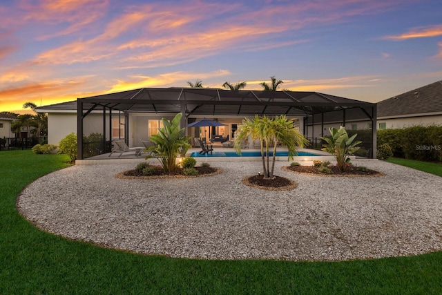 14210 9th Ter NE, Bradenton, FL 34212 - back of property with a patio, an outdoor pool, a yard, and a lanai