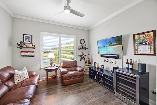 living room with a bar, beverage cooler, ornamental molding, and wood finished floors