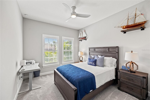 carpeted bedroom with baseboards and ceiling fan