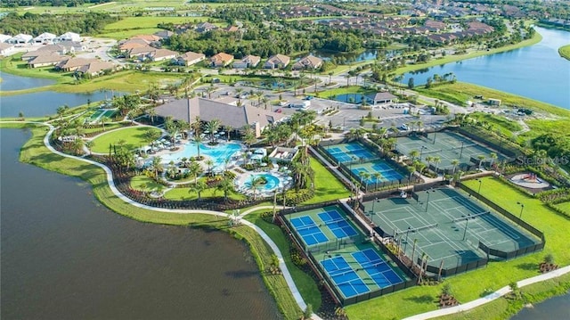 drone / aerial view featuring a water view and a residential view