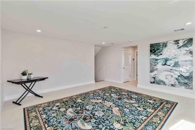 empty room with recessed lighting, visible vents, and baseboards