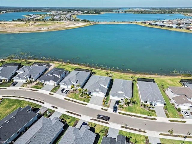aerial view featuring a residential view and a water view