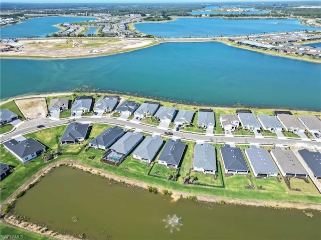 birds eye view of property featuring a residential view and a water view