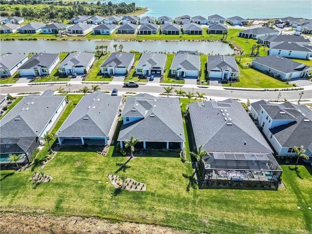 bird's eye view with a residential view and a water view