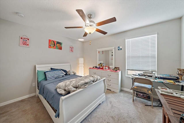 1723 Fred Ives St, Ruskin, FL 33570 - bedroom with light carpet, baseboards, and a ceiling fan
