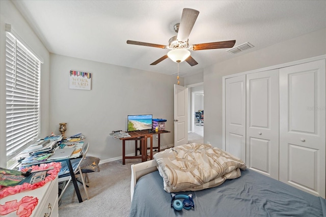 1723 Fred Ives St, Ruskin, FL 33570 - bedroom with a ceiling fan, a closet, visible vents, baseboards, and light colored carpet