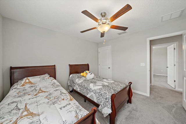 1723 Fred Ives St, Ruskin, FL 33570 - bedroom featuring light colored carpet, visible vents, baseboards, and a ceiling fan