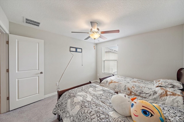 1723 Fred Ives St, Ruskin, FL 33570 - bedroom featuring a textured ceiling, carpet, visible vents, ceiling fan, and baseboards