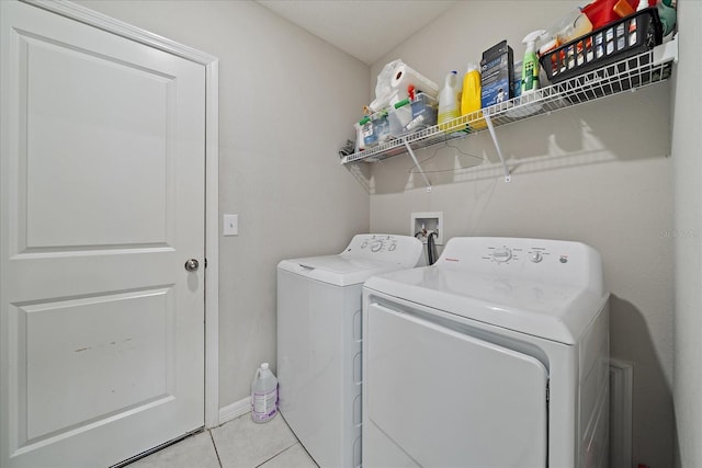 1723 Fred Ives St, Ruskin, FL 33570 - laundry room featuring washing machine and clothes dryer, laundry area, baseboards, and light tile patterned floors