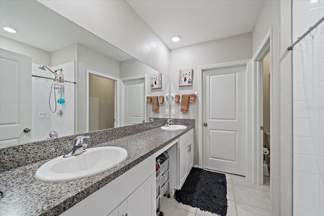 1723 Fred Ives St, Ruskin, FL 33570 - full bathroom featuring tile patterned flooring, tiled shower, a sink, and double vanity