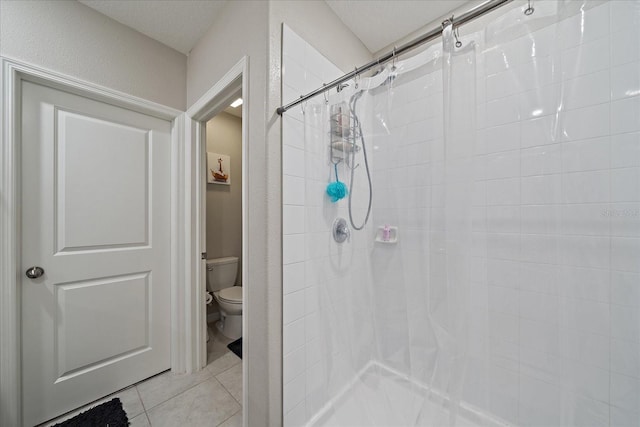 1723 Fred Ives St, Ruskin, FL 33570 - full bathroom featuring tile patterned flooring, toilet, and tiled shower