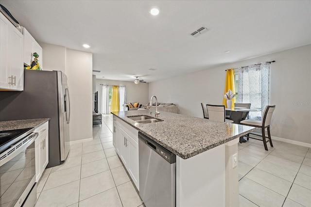 1723 Fred Ives St, Ruskin, FL 33570 - kitchen with a sink, visible vents, dishwasher, light tile patterned floors, and range with electric cooktop