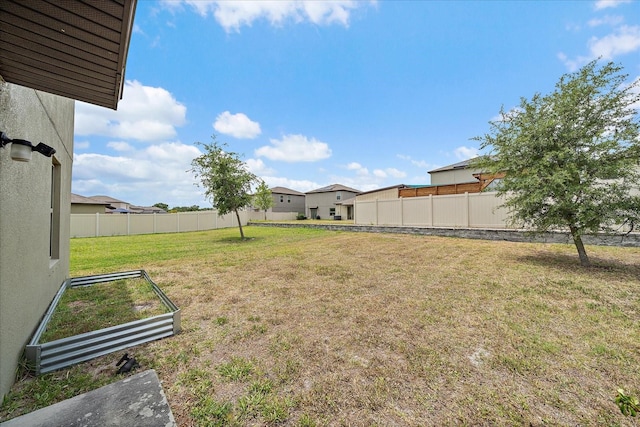 1723 Fred Ives St, Ruskin, FL 33570 - view of yard with a vegetable garden and fence