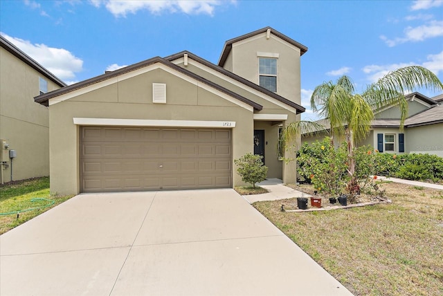 1723 Fred Ives St, Ruskin, FL 33570 - traditional-style home featuring concrete driveway, an attached garage, stucco siding, and a front yard