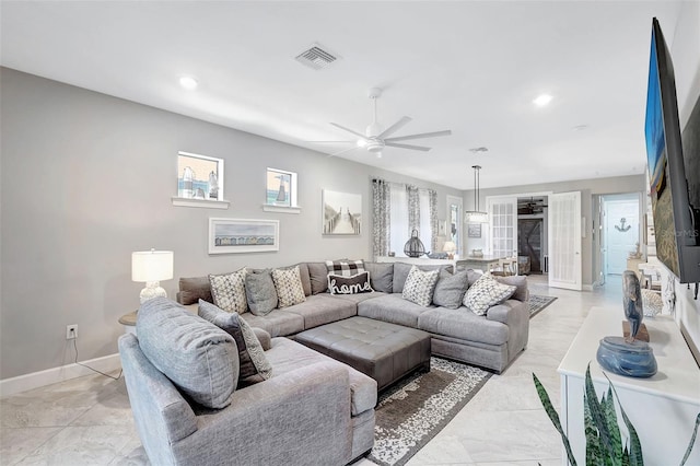 12291 Myrtle Bay Ct, Sarasota, FL 34238 - living area with a ceiling fan, recessed lighting, and light marble finish floors