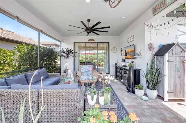 12291 Myrtle Bay Ct, Sarasota, FL 34238 - sunroom with an outdoor living space and ceiling fan