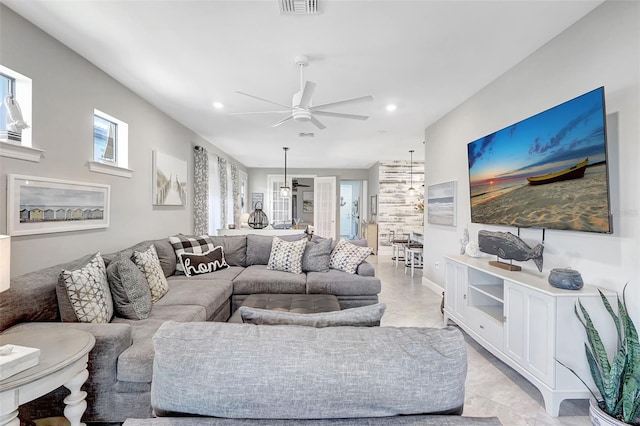 12291 Myrtle Bay Ct, Sarasota, FL 34238 - living room with a ceiling fan, recessed lighting, and light marble finish floors