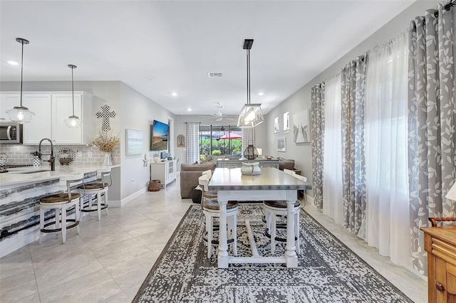 12291 Myrtle Bay Ct, Sarasota, FL 34238 - dining room featuring a ceiling fan and recessed lighting