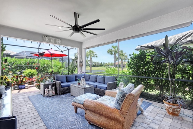 12291 Myrtle Bay Ct, Sarasota, FL 34238 - sunroom featuring a ceiling fan, outdoor lounge area, and healthy amount of natural light