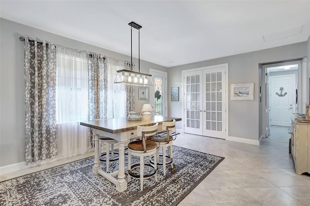 12291 Myrtle Bay Ct, Sarasota, FL 34238 - dining room with french doors and baseboards