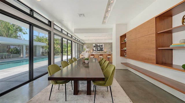 dining room with visible vents and finished concrete floors