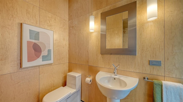 bathroom with toilet and a sink