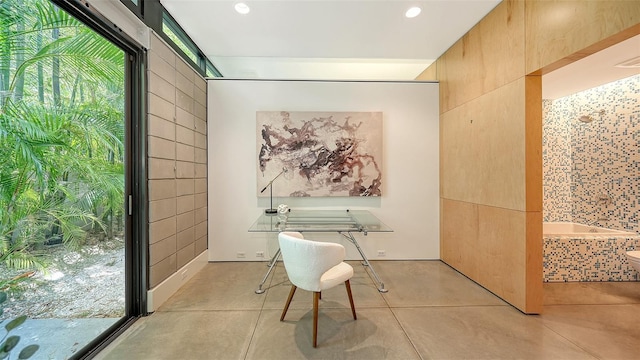 interior space with recessed lighting, light tile patterned flooring, and a healthy amount of sunlight