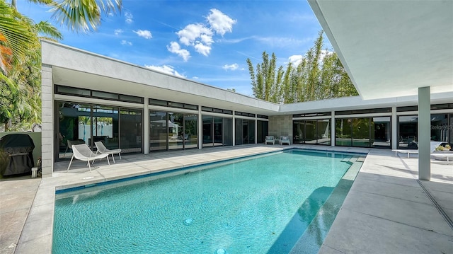 outdoor pool with a patio