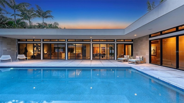 outdoor pool featuring a patio