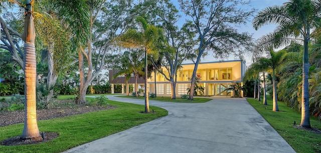 4123 Bay Shore Rd, Sarasota, FL 34234 - view of front of house featuring curved driveway and a front lawn