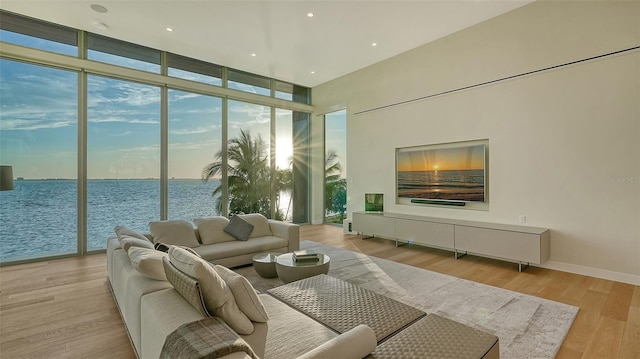 4123 Bay Shore Rd, Sarasota, FL 34234 - living room with a wall of windows and light wood-type flooring