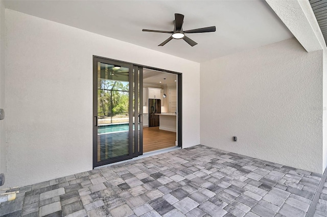 view of patio featuring a ceiling fan