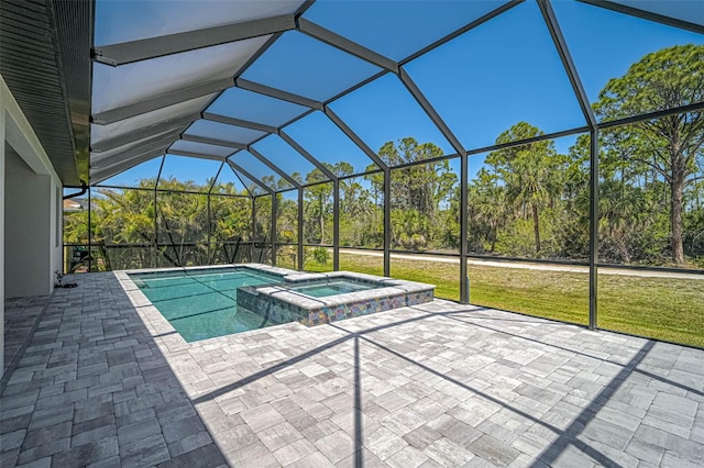 view of pool featuring a lanai, a patio area, a yard, and a pool with connected hot tub