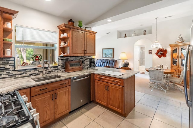 kitchen with lofted ceiling, open shelves, a sink, appliances with stainless steel finishes, and a peninsula