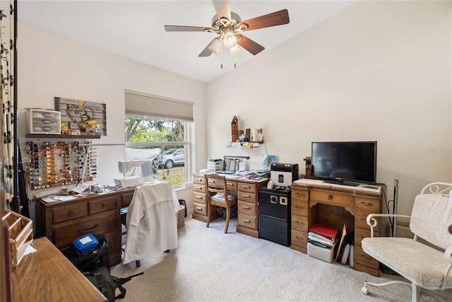 office space with lofted ceiling, a ceiling fan, and carpet floors