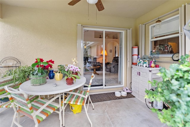 view of patio / terrace featuring outdoor dining area and ceiling fan
