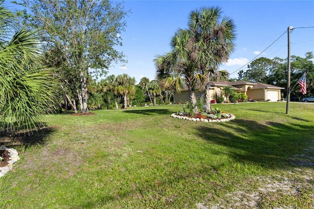 view of yard featuring an attached garage